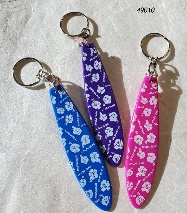 49010 Souvenir plastic keyring shaped like a surfboard with Catalina Hibiscus design.  3 Assorted colors. 