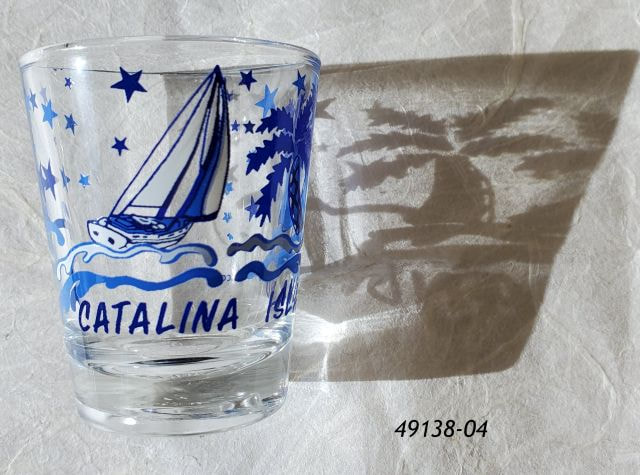 Catalina Souvenir shotglass blue tone sailboat palms trees design. 