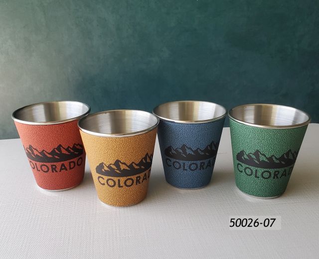 50026-07 Colorado Souvenir Shotglass, stainless steel with leatherette wrap in four assorted colors and printed mountain range graphic. 