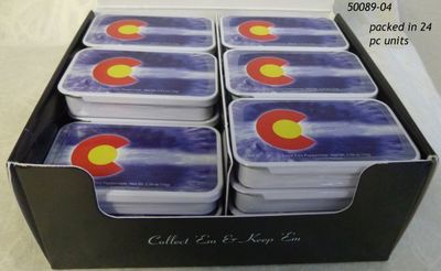 Display box of souvenir breath mint tins.  Colorado Tie Dye Flag design.  
