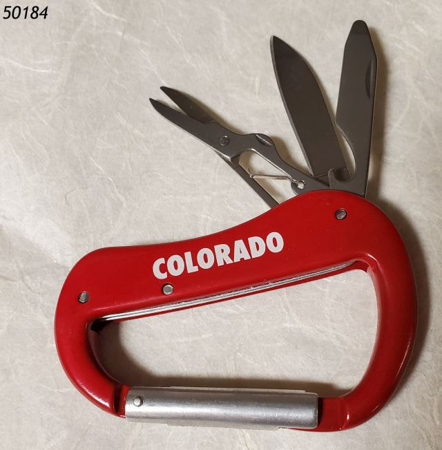 Red Carabiner with two pocket knife inserts and a mini pair of scissors.   Imprinted with souvenir Colorado imprint in white. 