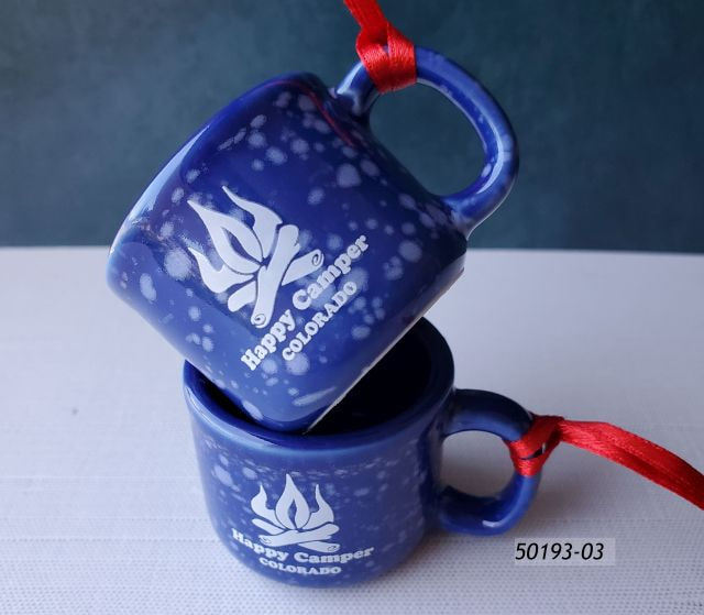 50193-03 Colorado Souvenir MIniature porcelain cup ornament with a blue speckle finish and campfire design that reads Happy Camper Colorado.