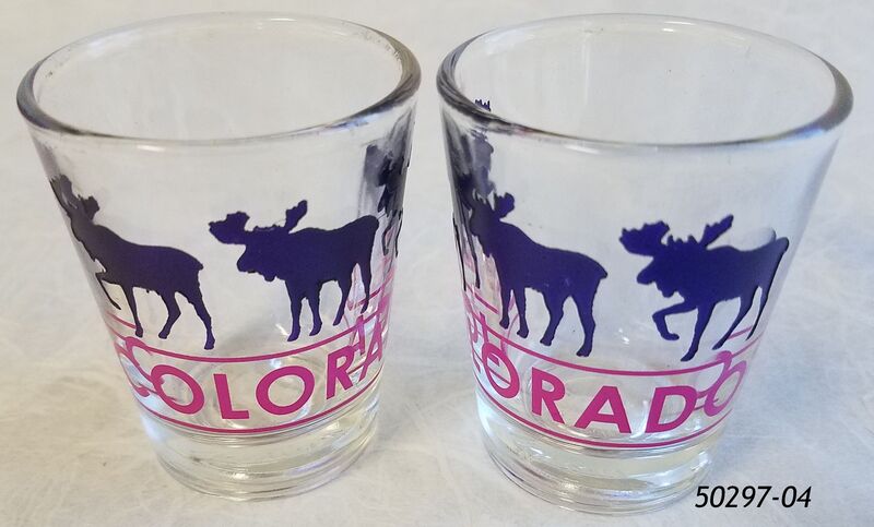 Colorado Souvenir etched shotglass purple moose design. 