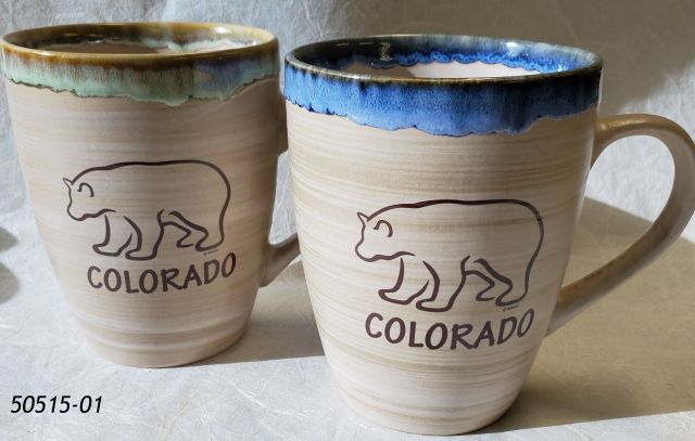 50515-01 Colorado Souvenir Mug. Oval shape with colored reactive glaze rim.  Colorado Bear design on one side.  