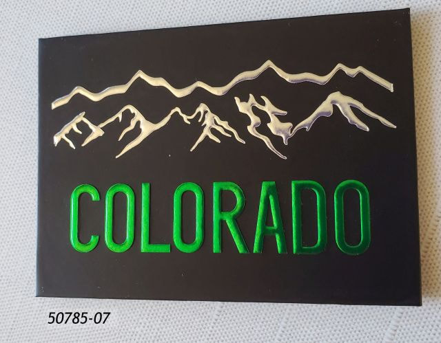 50785-07 Colorado Flat Magnet in matte black with shiny silver mountains and shiny green lettering to read Colorado