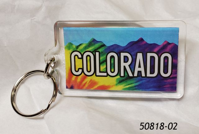 50818-02 Colorado souvenir plastic rectangular keyring with colorful Tie Dye Mountains design and blue sky.  