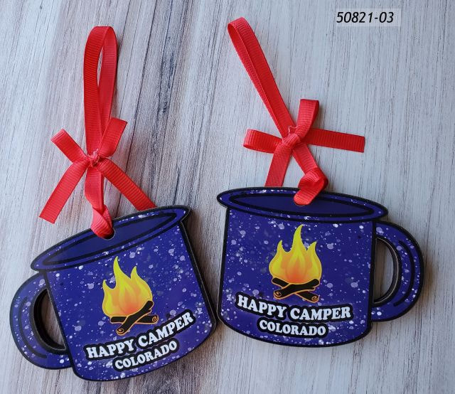 50821-03 Colorado Souvenir Ornament shaped like a camper mug with a "Happy Camper" Campfire design.  Red ribbon w a bow. 