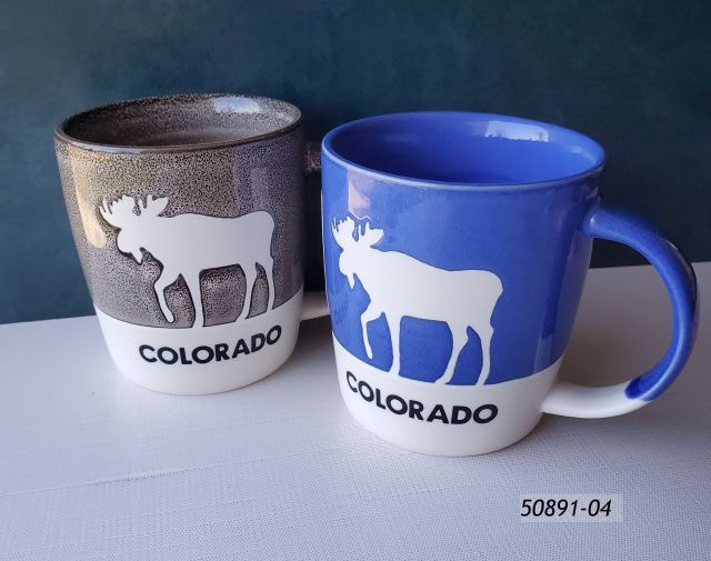 50891-04 Colorado Souvenir mug in two colors, brown and blue with a reverse image of a moose against the color field.  Large handle. 