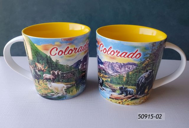 50915-02 Colorado Souvenir taper mug w yellow liner and multi color design with many, many animals hanging out by the river and near a Welcome to Colorful Colorado sign. Also mountains and trees.  